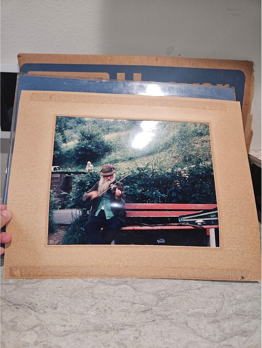 Vintage Photograph of Man Playing Violin on Bench
